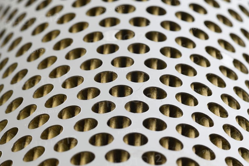 Detail of a tractor oil filter creates an industrial textured background