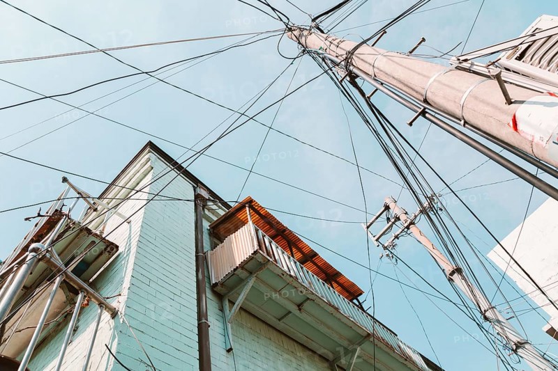 Telegraph pole and old buildings low angle view in Seoul, korea