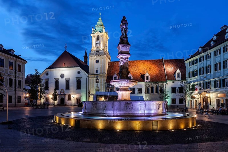 City of Bratislava at night in Slovakia, Roland Fountain, Old Town Hall building and Jesuit Church at Main Market Square