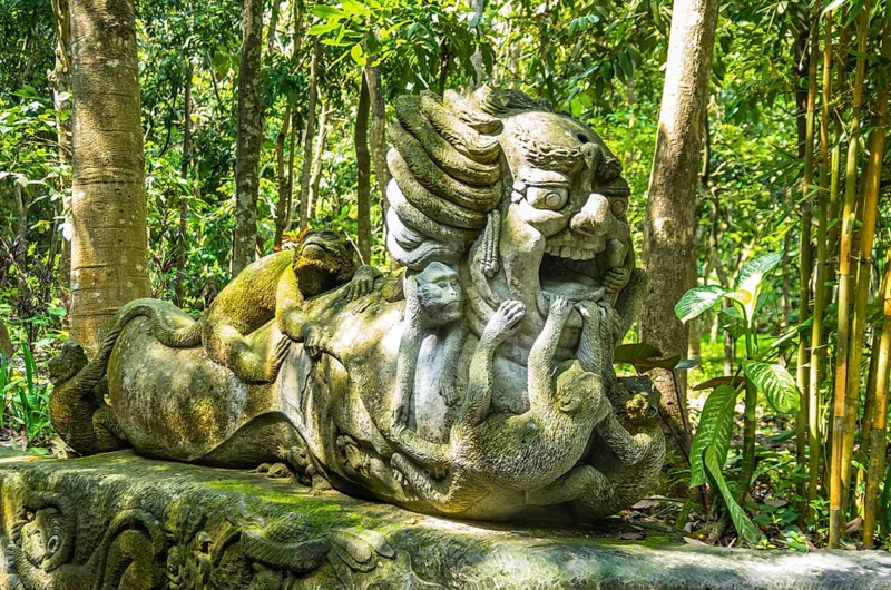 Monkey sculpture in sacred Monkey Forest park, Ubud, Bali, Indonesia