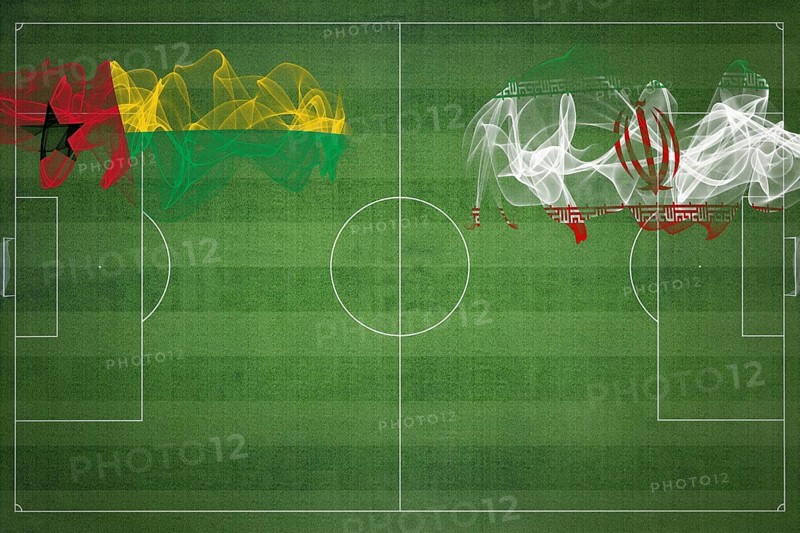 Guinea Bissau vs Iran Soccer Match, national colors, national flags, soccer field, football game, Competition concept, Copy space