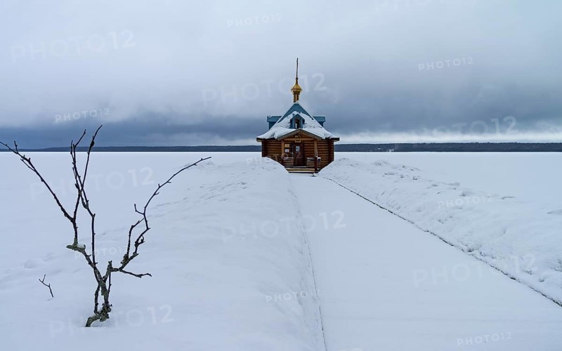 Chapel of St. John the Baptist (baptistery) in Orthodox monastery. Vygozero, Karelia, Russia. Cloudy day, the beginning of March