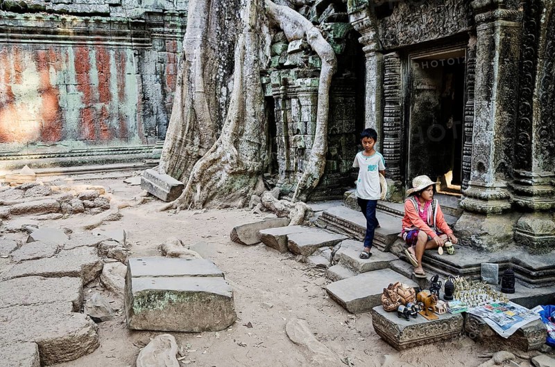 Souvenir trinket stall vendor in angkor wat famous landmark buddhist temple ruins near siem reap cambodia