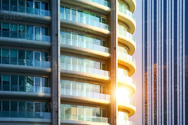 Urban abstract close up view of steel and glass windows facade office building