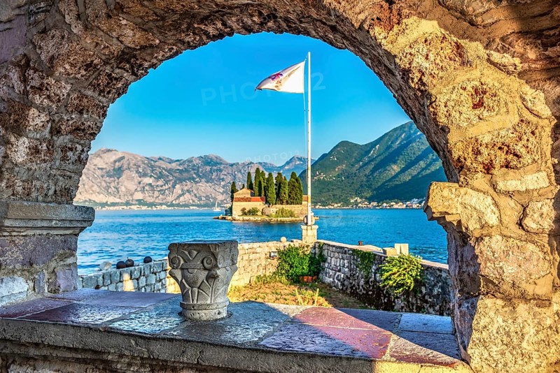 View on St George island from Our Lady of the Rocks through arch. Perast, Montenegro