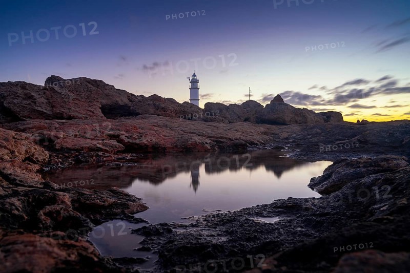 A long exposure view of the Cap de ses Salines Lighthouse on Mallorca at sunrise