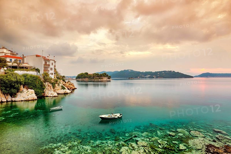 The sunrise at the old port in the Chora of Skiathos island, Greece