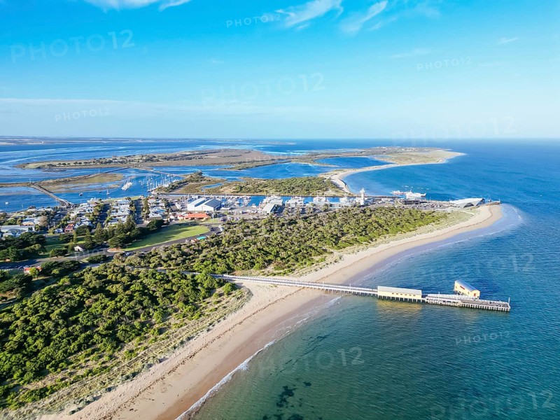 Aerial views of Queenscliff pier and Sorrento ferry area at dusk on a summer's day on the Bellarine Peninsula, Victoria, Australia