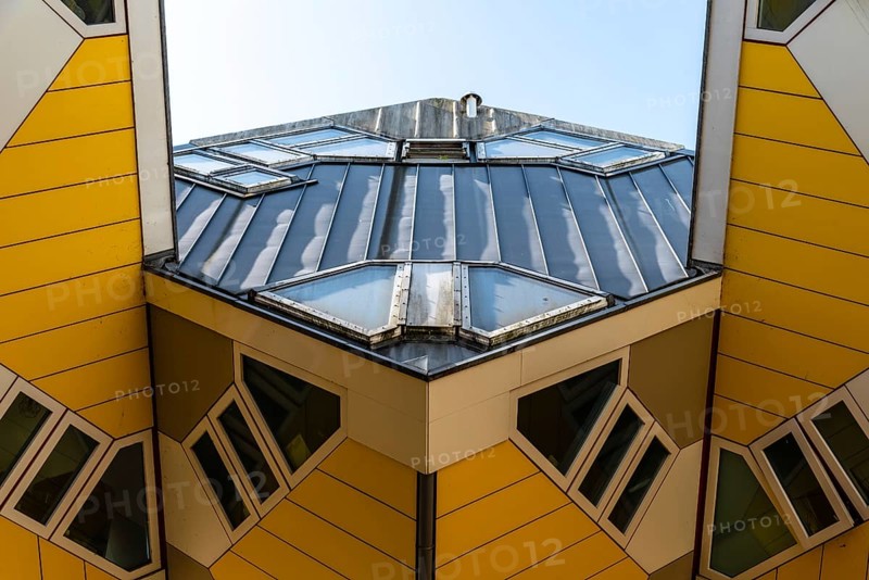 Rotterdam, Netherlands, May 8, 2022: Yellow cubic houses in Rotterdam. The Cubic Houses were designed by Piet Blom architect