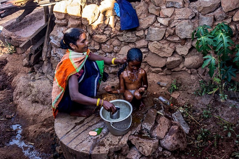 Mother bathing child, Araku, Andhra Pradesh, India, Asia