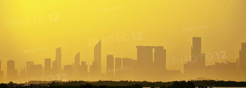 Sandstorm, samum, haboob over the southern megalopolis, the outline of skyscrapers are drowning in yellow haze. Abu Dhabi