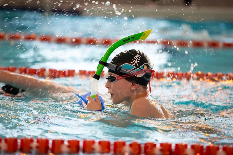March 10, 2021. Belarus. the city of Gomil. Sports pool. Child athlete swims in the pool