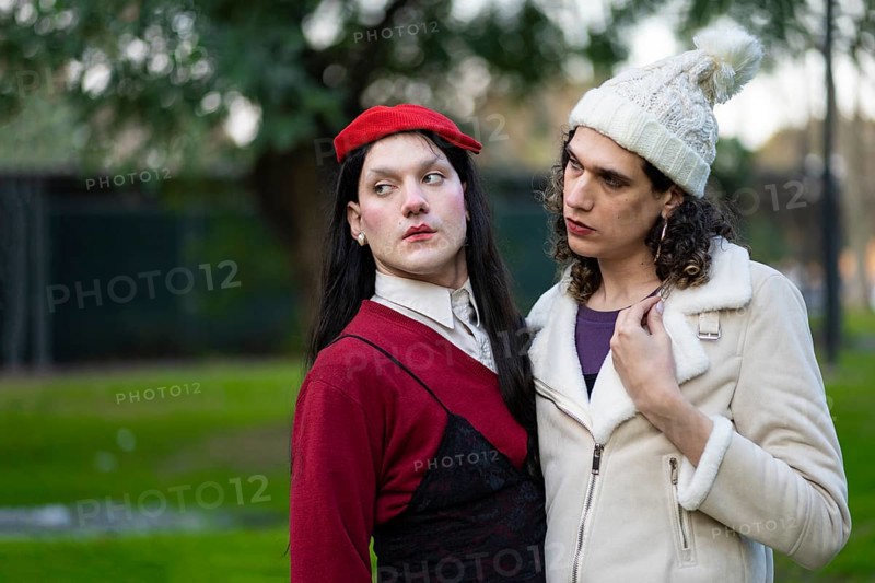 Couple of transgender women posing sensually in a park