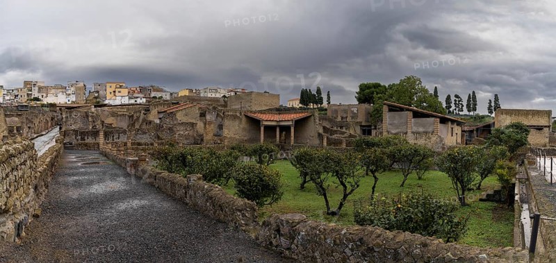 Ercolano, Italy, 25 November, 2023: orchard and street in the excavated ancient Roman city of Herculaneum