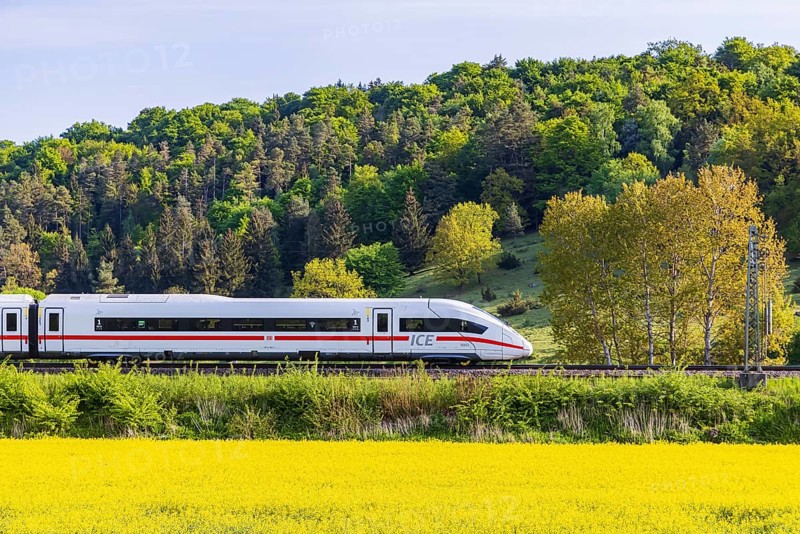 InterCityExpress ICE travelling across the Swabian Alb. Idyllic landscape in spring. Lonsee, Baden-Württemberg, Germany
