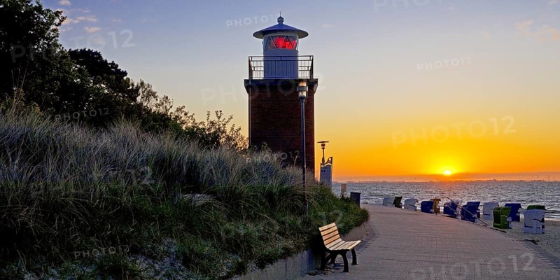 Olhörn lighthouse at colourful sunrise over the sea on the North Frisian island of Föhr, Schleswig-Holstein, Germany