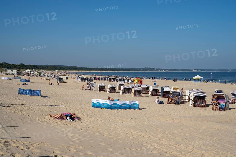 Beach chairs and tourists on the sandy beach, Swinemünde, Usedom Island, Baltic Sea, Poland