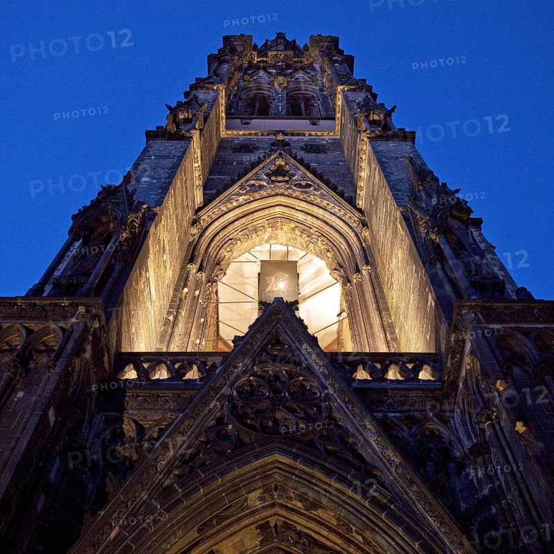 Illuminated church tower of the St. Nikolai memorial, ruins of the former main church of St. Nikolai, Hamburg, Germany