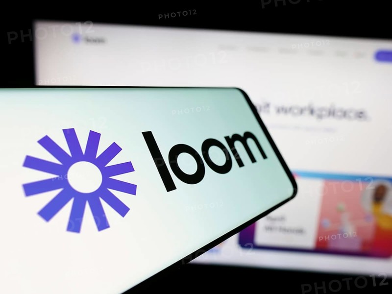 Stuttgart, Germany, 12-29-2023: Smartphone with logo of American video communication software company Loom Inc. in front of business website. Focus on center of phone display