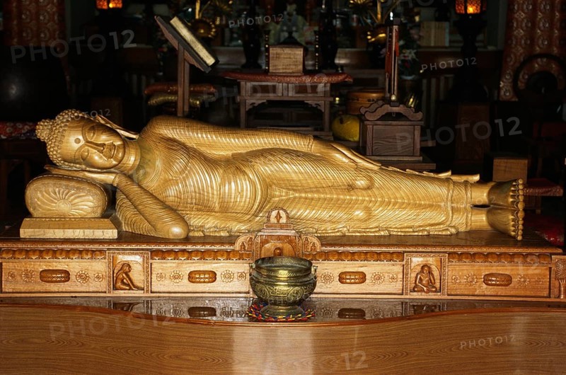 Nirvana, sleeping Buddha sandal wood statue in Horinji Japanese temple, Sarnath, Uttar Pradesh, India