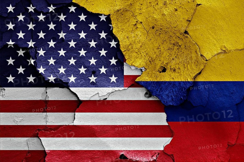 Flags of USA and Colombia painted on brick wall