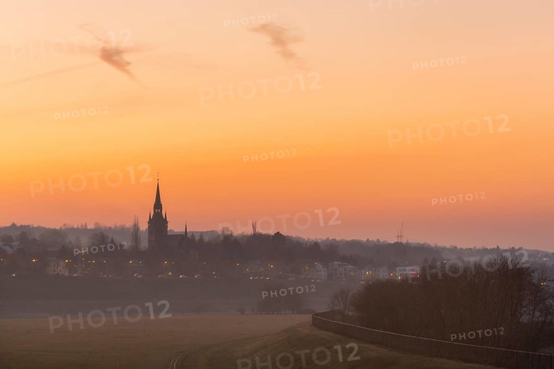 Sunset with the Briesnitz church, large amounts of Sahara dust colour the evening sky particularly red, Dresden, Saxony, Germany