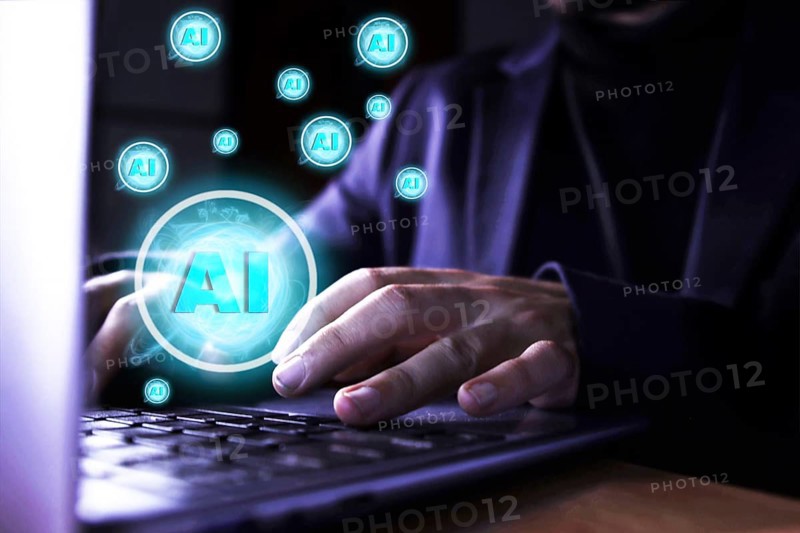 Close up of a man using a computer with artificial intelligence icons. use of artificial intelligence