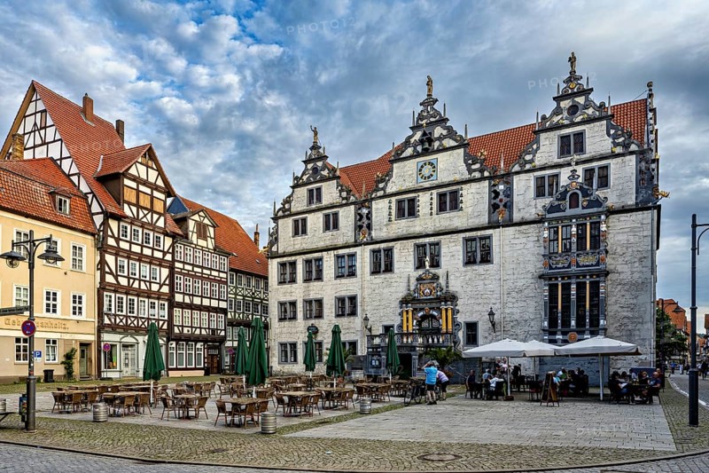 Historic square with half-timbered houses and classic buildings, under a cloudy sky, The historic town hall of Hannoversch Münden in Lower Saxony