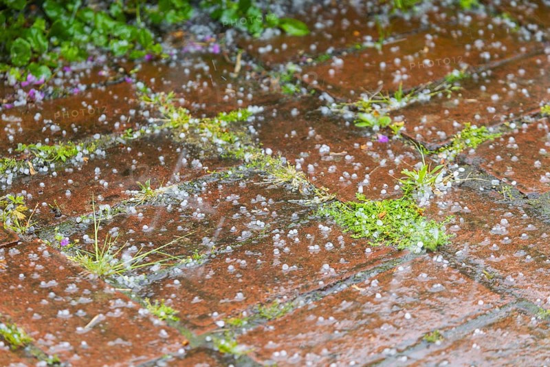 Storm over Bannewitz Hailstones on brick pavement, Bannewitz, Saxony, Germany