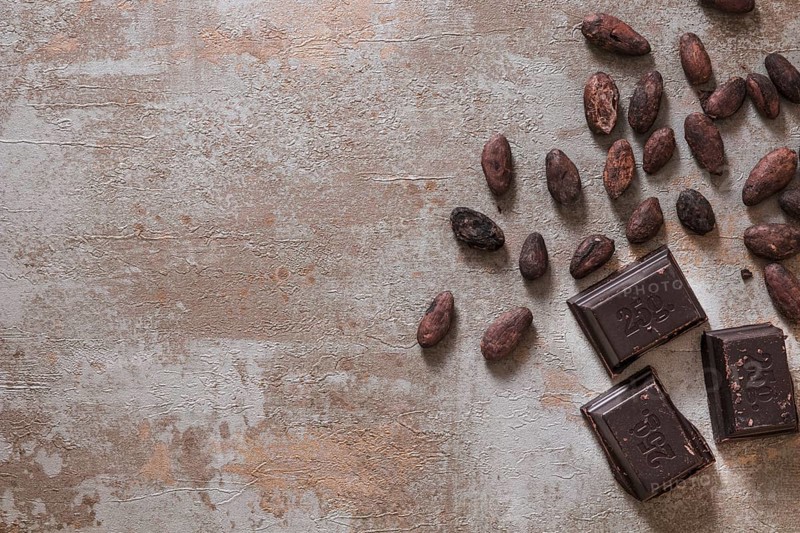 Chocolate pieces with raw cocoa beans rustic background. Resolution and high quality beautiful photo