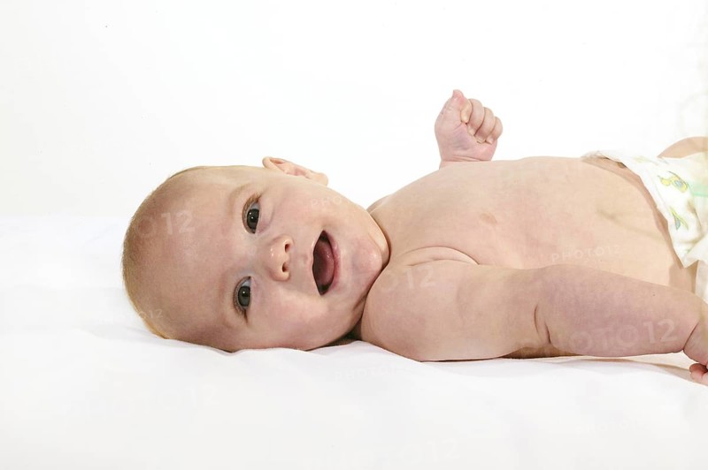 SMILING BOY AGAINST WHITE BACKGROUND
