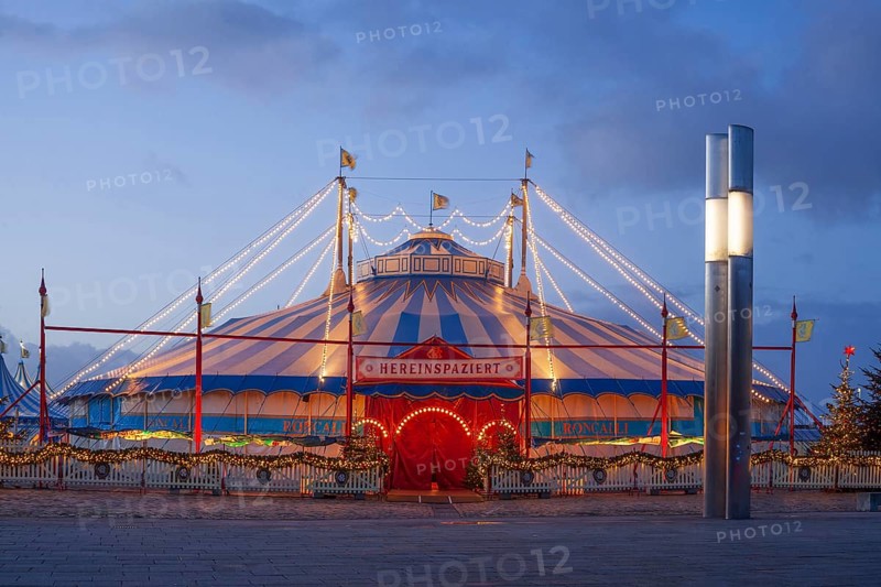 Circus Roncalli with Christmas lights at dusk on the Bürgerweide, Bremen, Germany