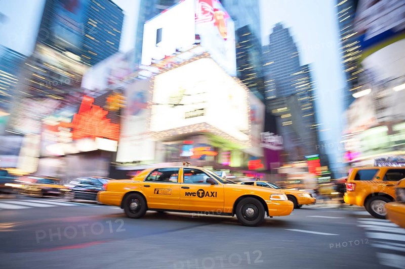 Panning image of a Yellow Taxi cab in Times Square, New York City. New York. USA