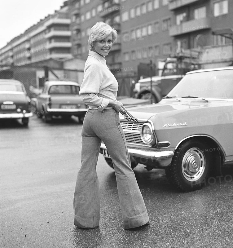 Fashion of the 1970s. A young woman wearing the typical fashion of the 1970s, wide legged trousers. A style called Bell-bottoms or flares, trousers that become wider from the knees and downward, forming a bell-like shape of the trouser leg. 1971. Kristoffersson ref EF65