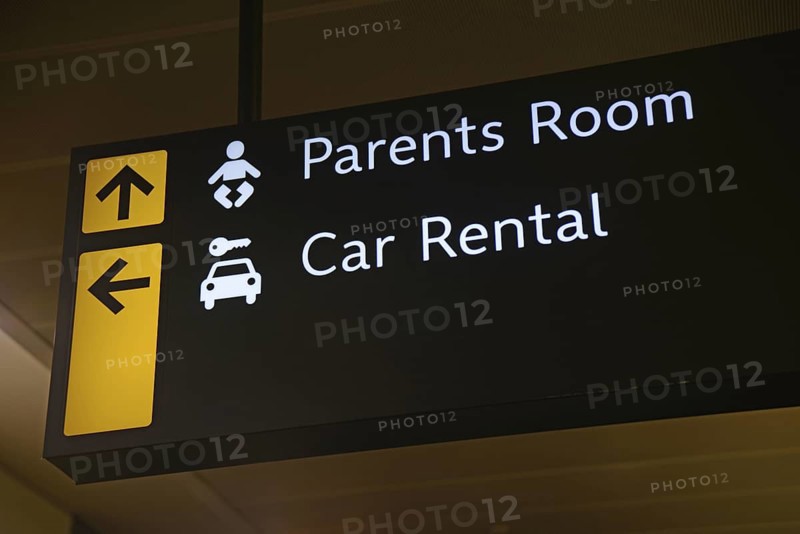 Airport signage for the parents room and car rental at Wellington, New Zealand