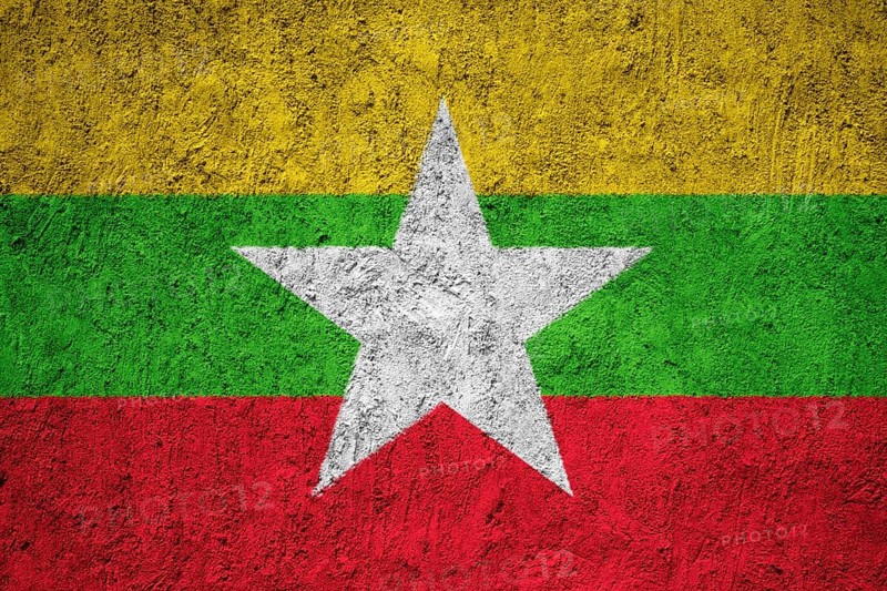 Myanmar flag painted on the cracked grunge concrete wall