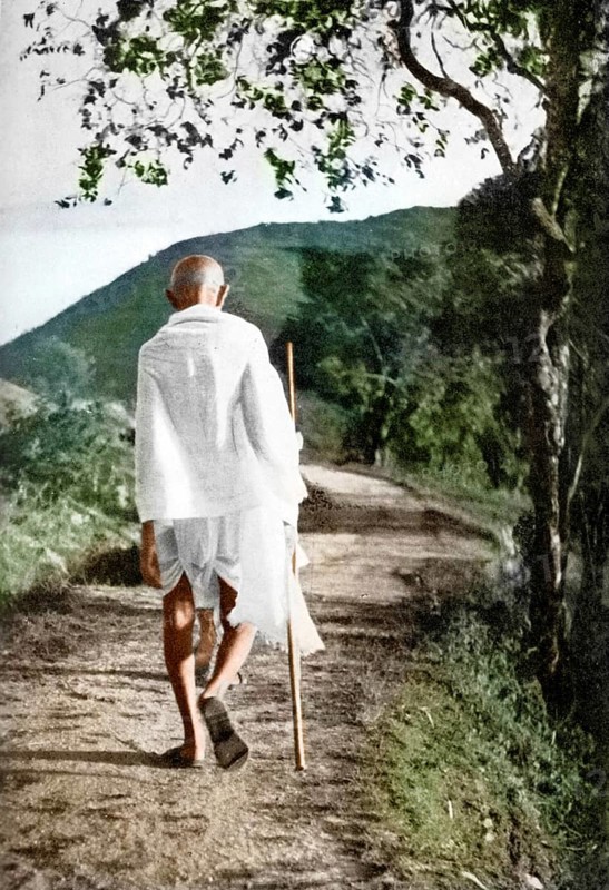 Mahatma Gandhi walking with stick, India, 1937