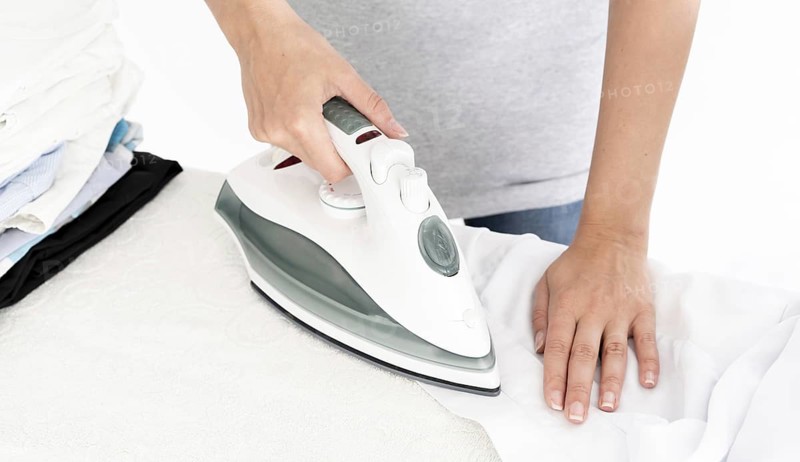 Unrecognisable lady ironing clothes. Resolution and high quality beautiful photo