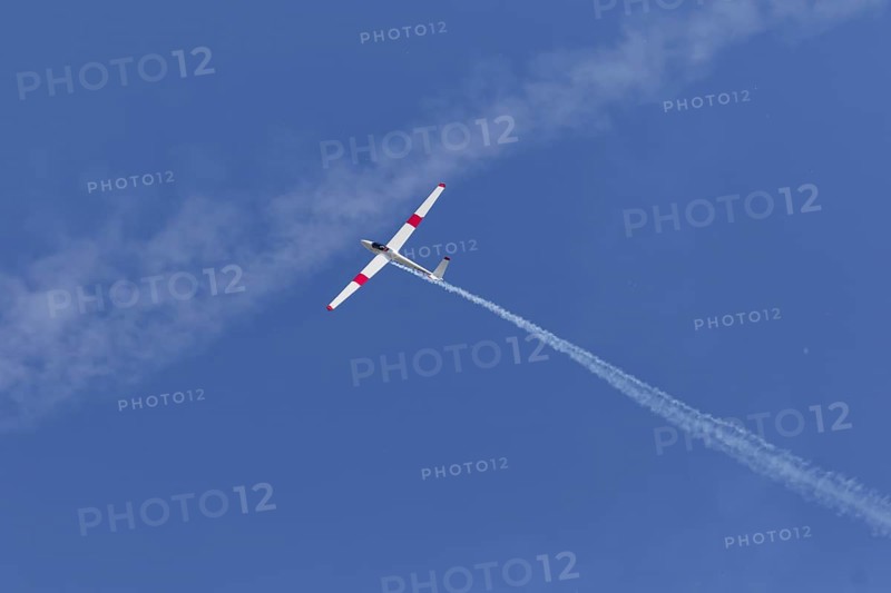 Airshow, glider with contrails against blue sky, Montreal, Province of Quebec, Canada