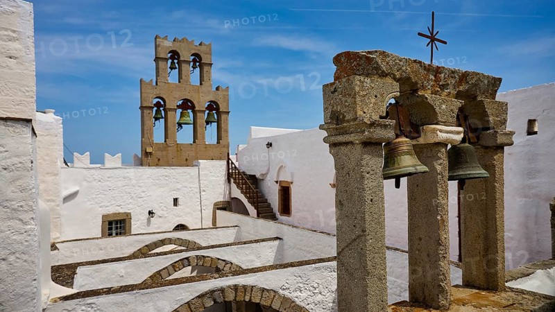 Historic architecture with bell tower under a blue sky, St John's Monastery, Ancient columned section, Agiou Theologou Monastery, Monastery of St John the Theologian, World Heritage Site 1999, Patmos, Dodecanese, Greek Islands, Greece
