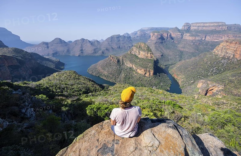Hiker enjoying panorama, Blyde River Canyon with summit Three Rondawels, view of canyon with river Blyde River and table mountains, canyon landscape, Panorama Route, Mpumalanga, South Africa