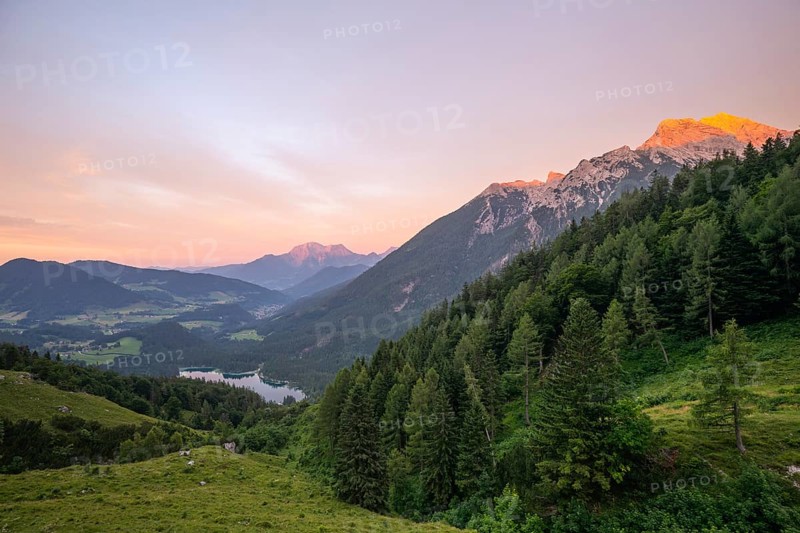 Magical sunset with alpenglow at the Halsalm above Hintersee with views of Hoher Göll and Hochkalter