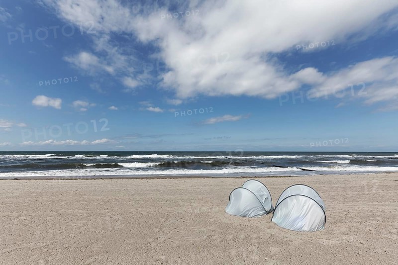 Lonely beach with two silver beach shells on the Baltic Sea, blue sky, Kühlungsborn, Mecklenburg-Vorpommern, Germany