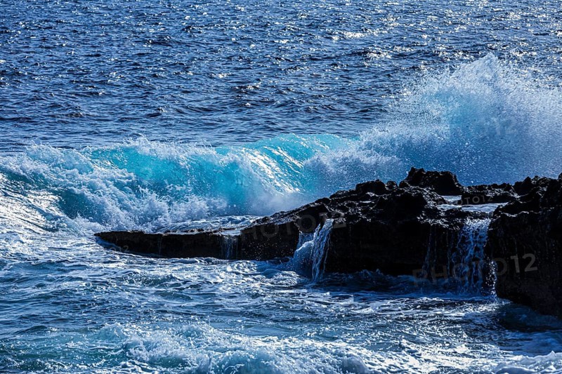 Rugged rocky coastline and foaming spray, on Stecci beach, near Capoliveri, Elba Island, Tuscan Archipelago National Park, Tuscany, Italy