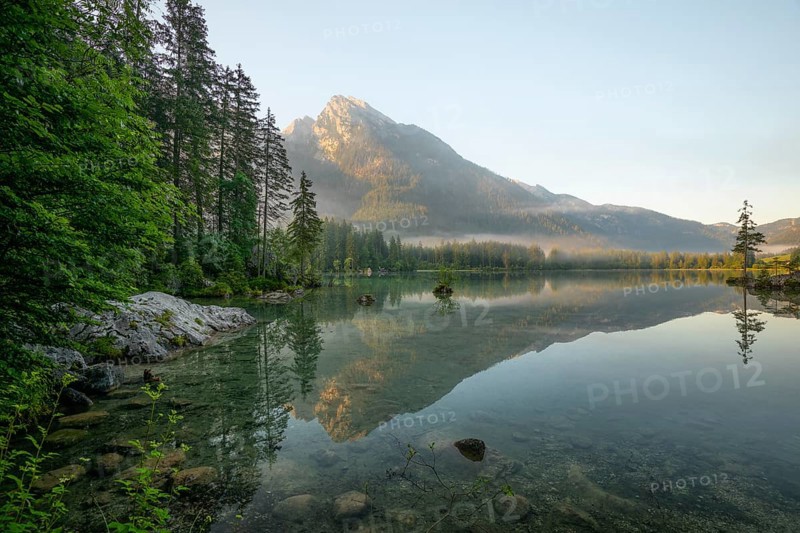 Magical sunrise with fog at Hintersee near Ramsau in Berchtesgadener Land