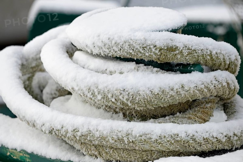 Thick ship rope covered with snow, close-up, North Sea, Norddeich, Lower Saxony, Germany