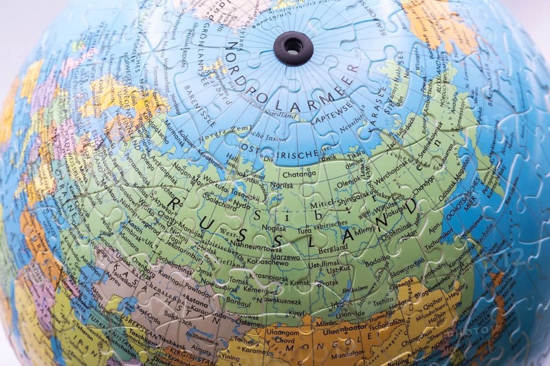 Puzzle globe. Map made from puzzle pieces. Russia