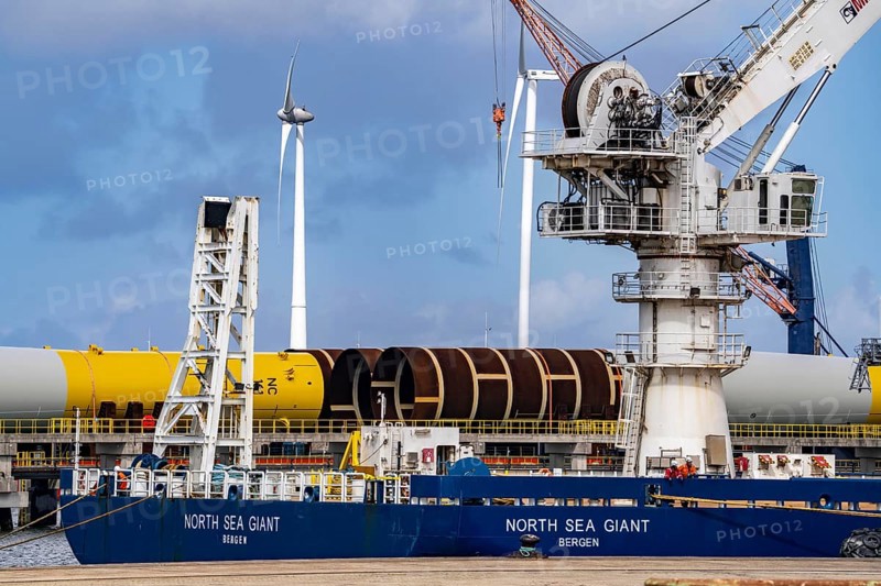 The seaport of Eemshaven, Julianahaven Basin, where the foundation structures, monopiles, for offshore wind farms are stored, which then support the actual wind turbines, the components are transported to the wind farms in the North Sea on large workboats and anchored to the seabed, where the wind turbines are then built, Eemshaven, Netherlands