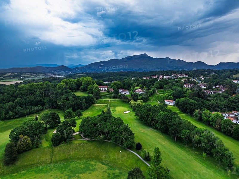 Sunset and storm clouds over Pyrenees and Saint-Jean-de-Luz from a drone, Nouvelle-Aquitaine, Pyrenees-Atlantiques, France