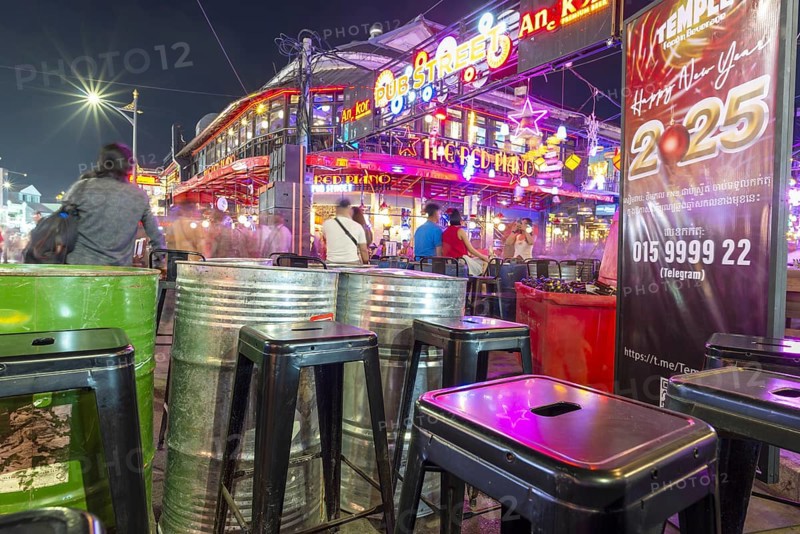 Neon lights, the legendary restaurant THE RED PIANO, Pub Street in the evening, entertainment district with bars and restaurants, Siem Reap, Cambodia